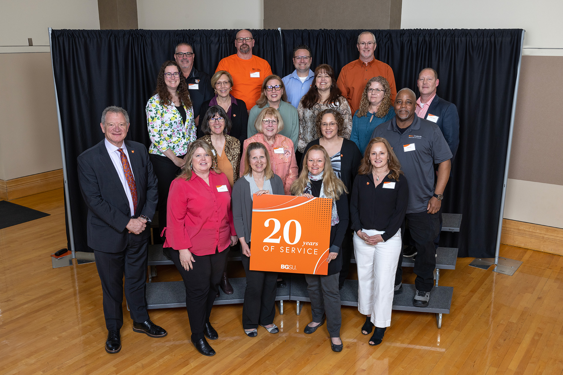 BGSU President Rodney K. Rogers stands with 20-year employees