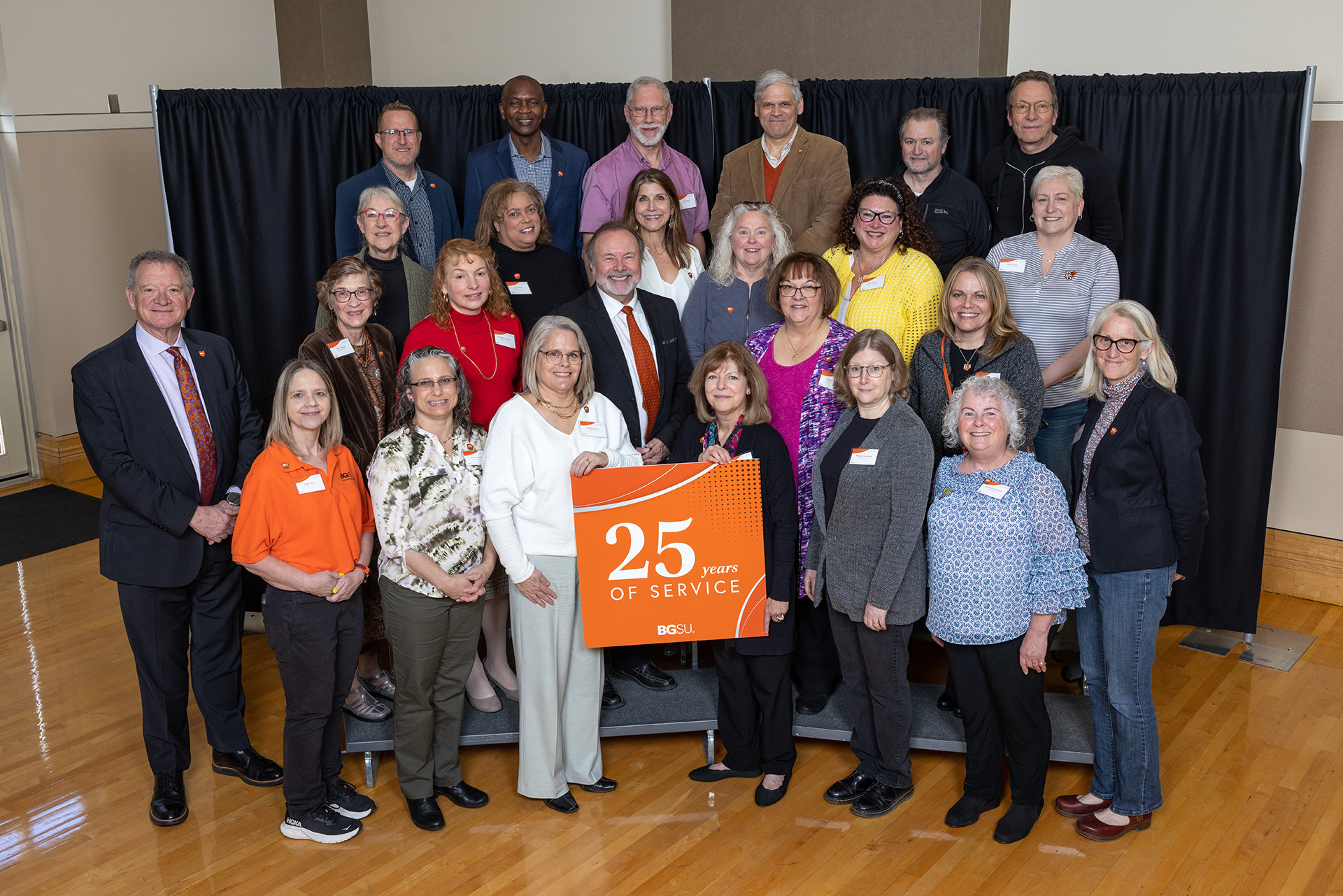 BGSU President Rodney K. Rogers stands with 25-year employees