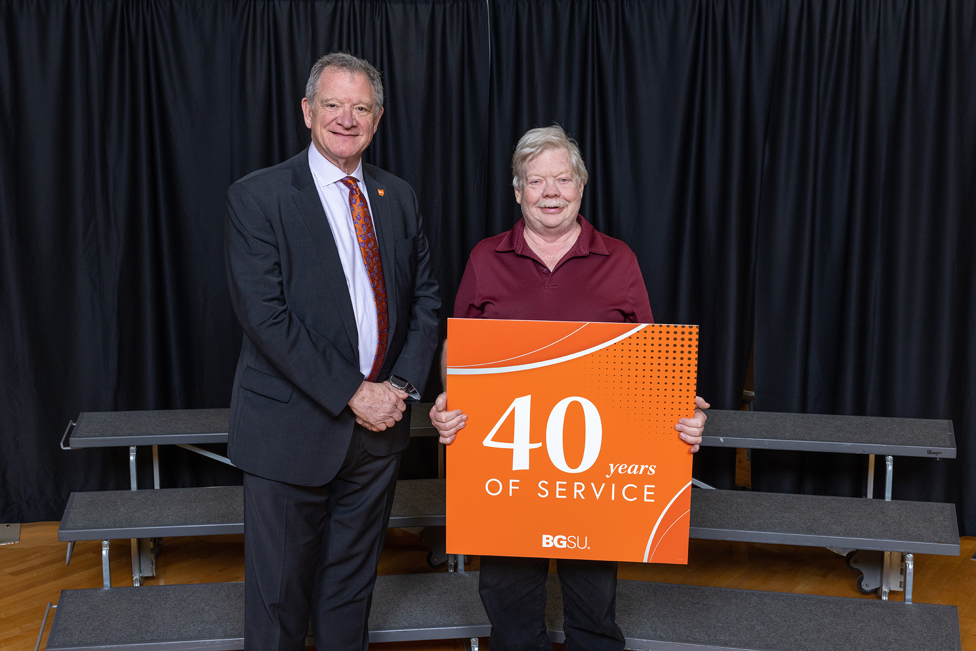 BGSU President Rodney K. Rogers stands next to a 40-year employee