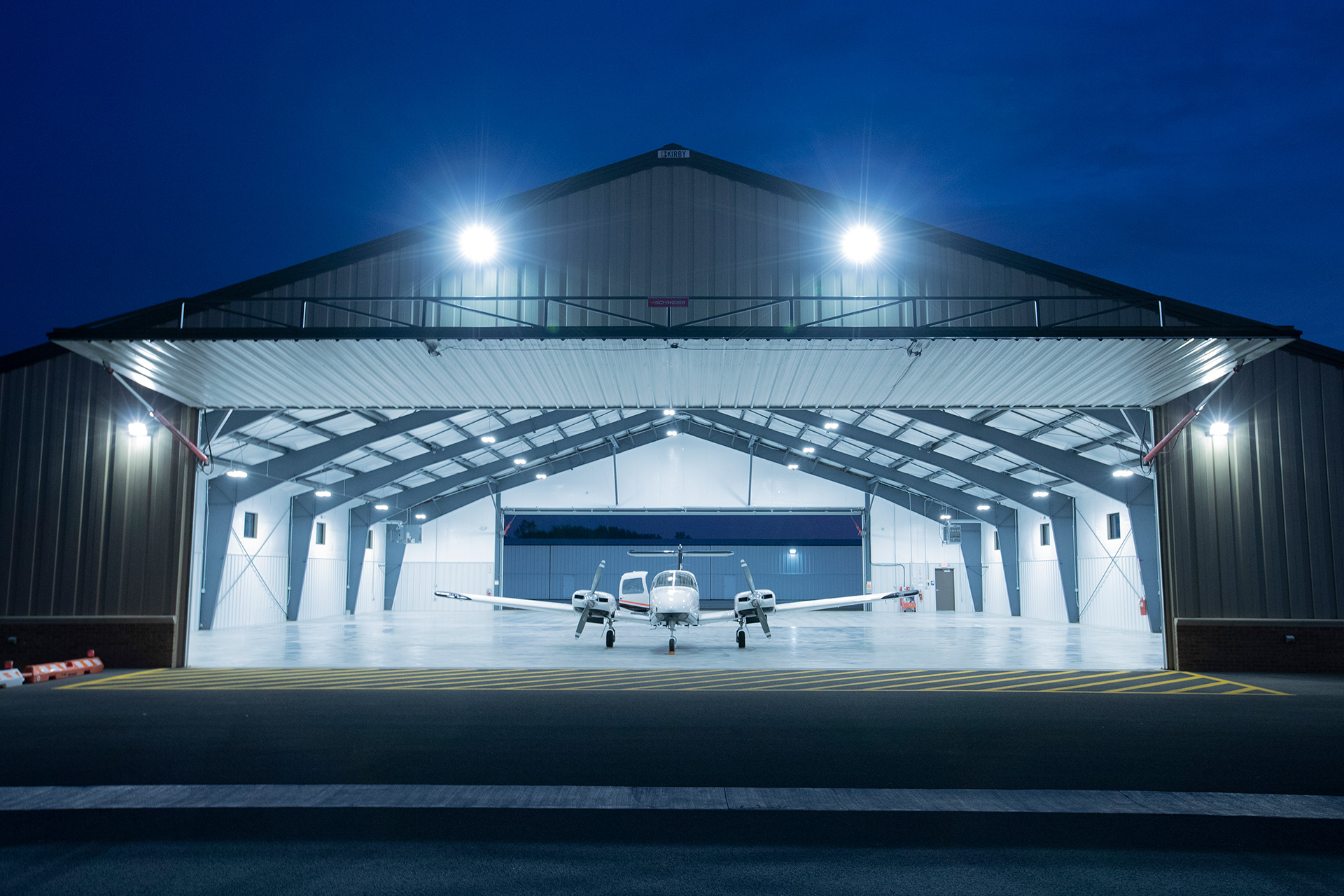 An airplane in a hangar.