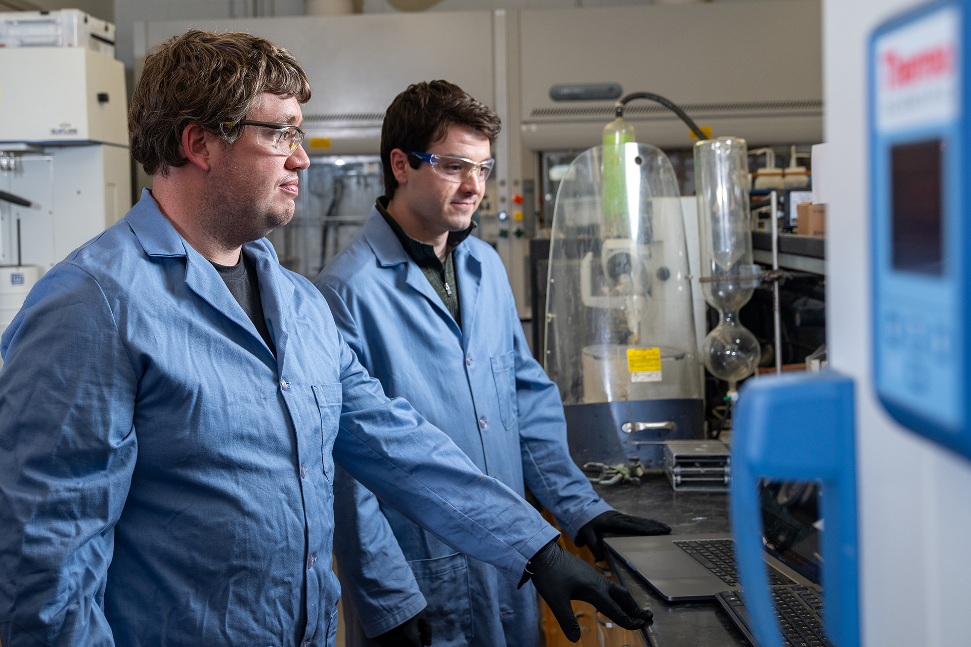 Two scientists work in a lab