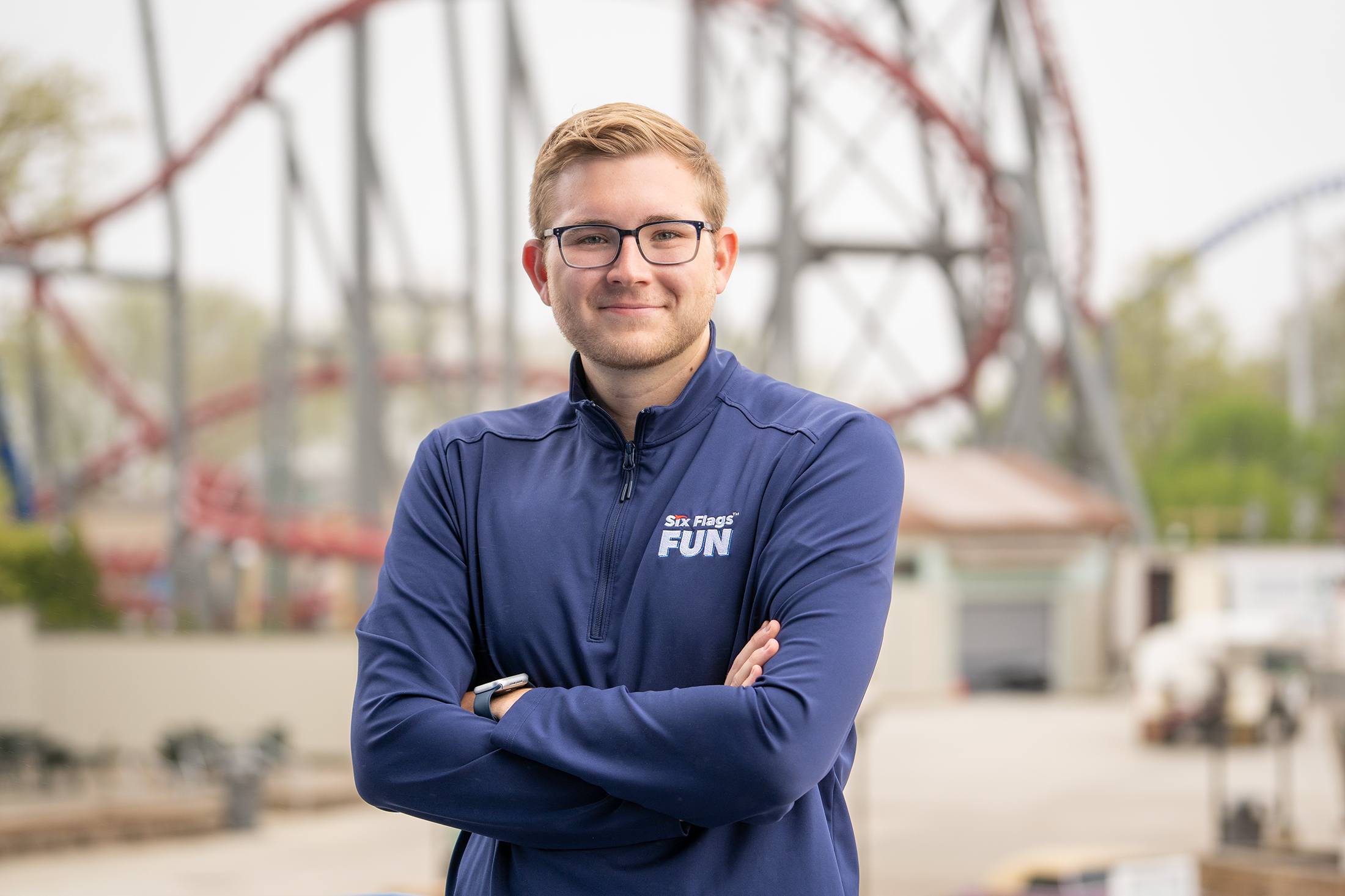 Ethan Tinkey with roller coasters in the background