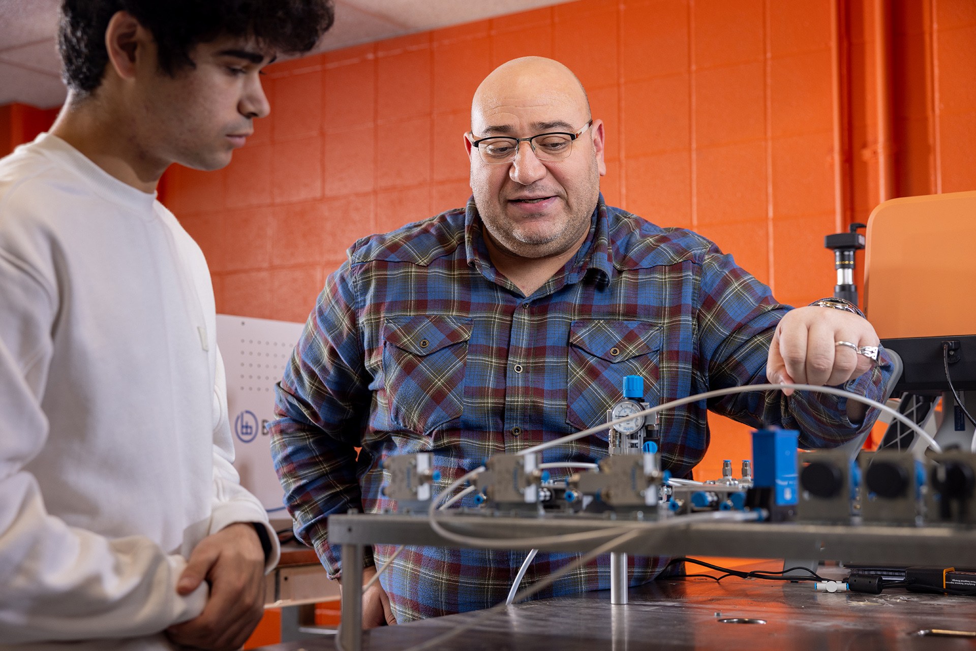 A BGSU engineering professor and a student in a robotics lab on campus