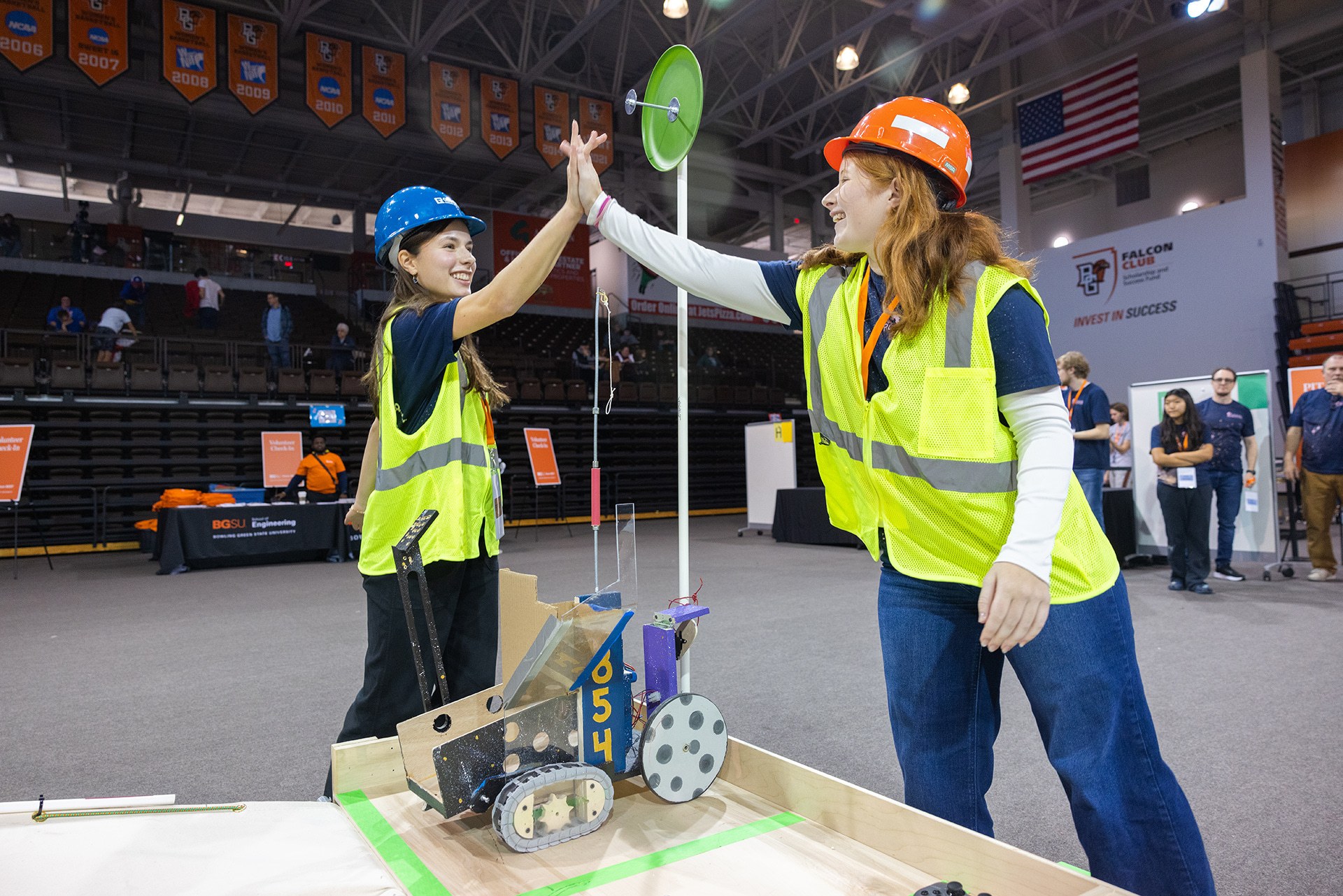 Two students celebrate during a robotics competition at BGSU