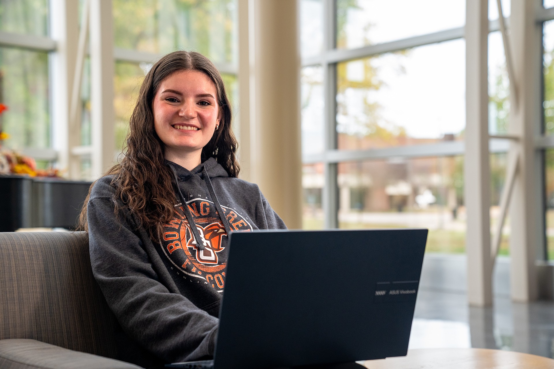 A headshot of Kendall Balde sitting with a loptop