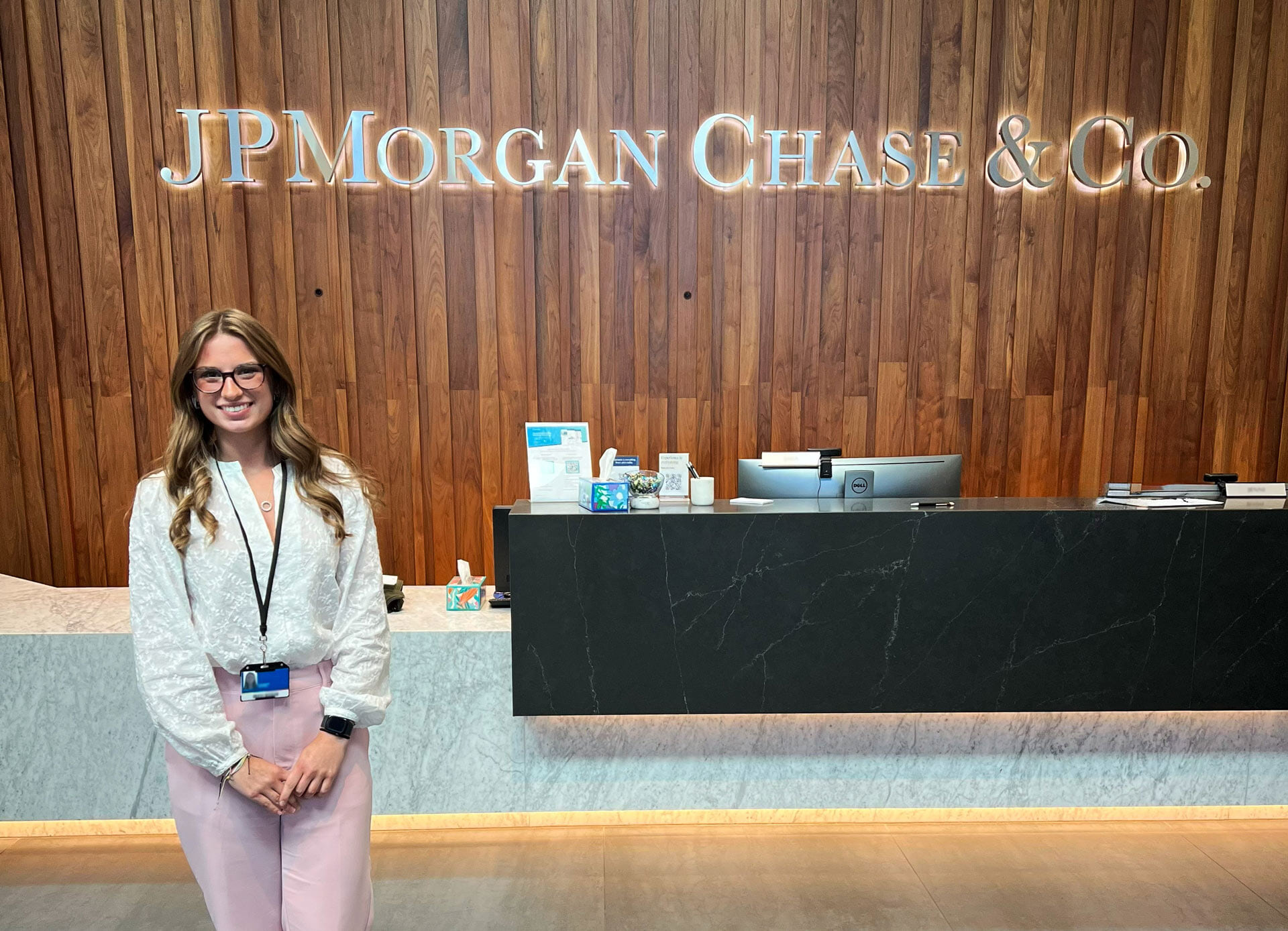 A woman stands in the lobby of JPMorganChase & Co.
