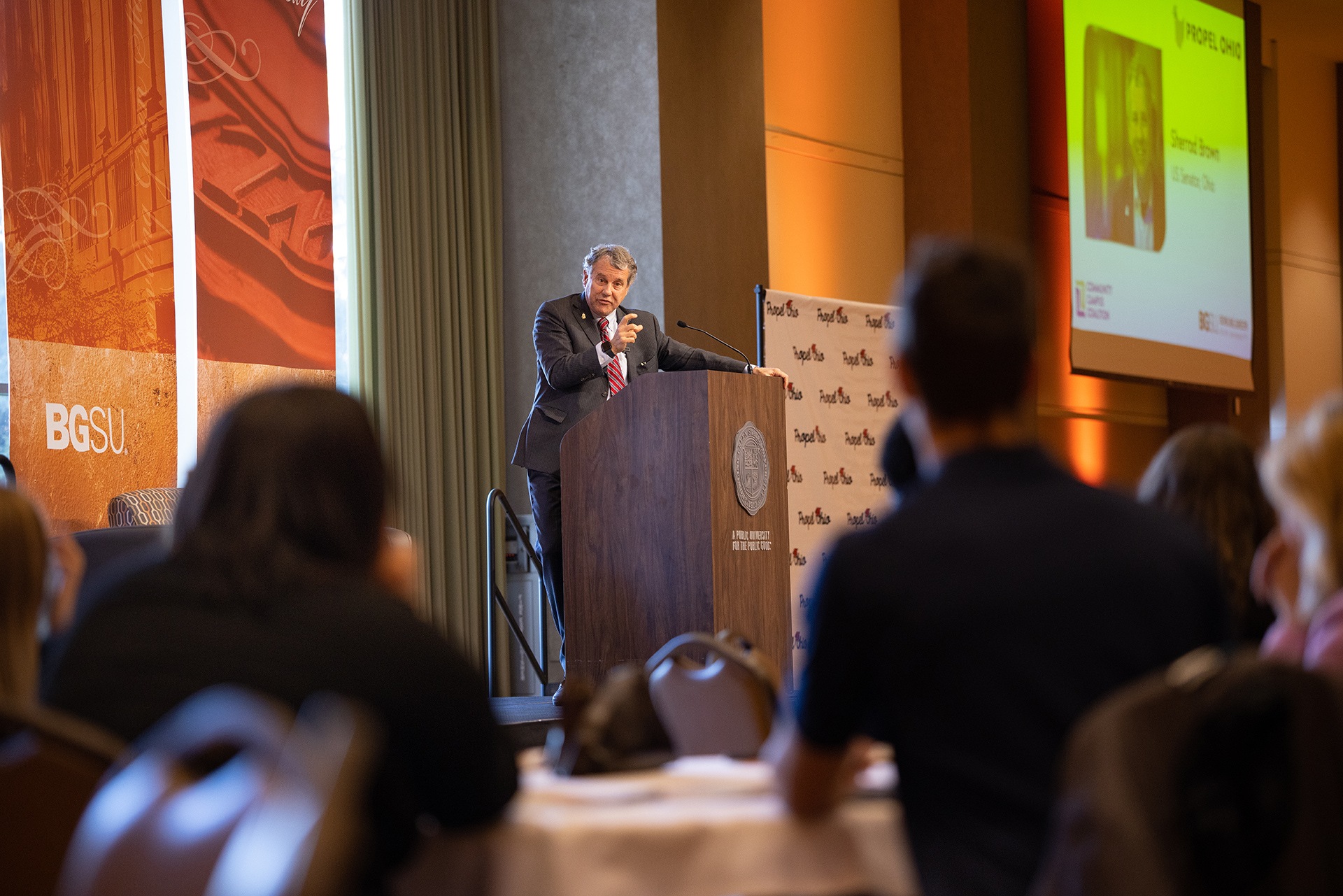 Former U.S. Sen. Sherrod Brown speaks from a podium during the Propel Ohio conference at BGSU