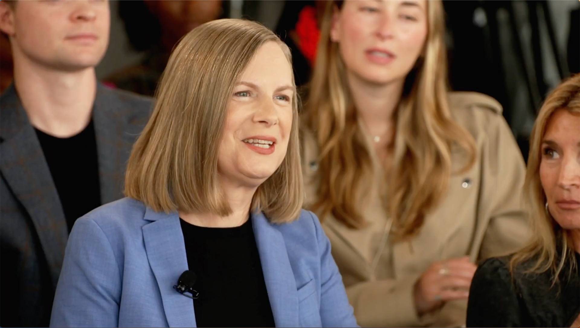 A person sits in the crowd of a live taping of "The Oprah Podcast"