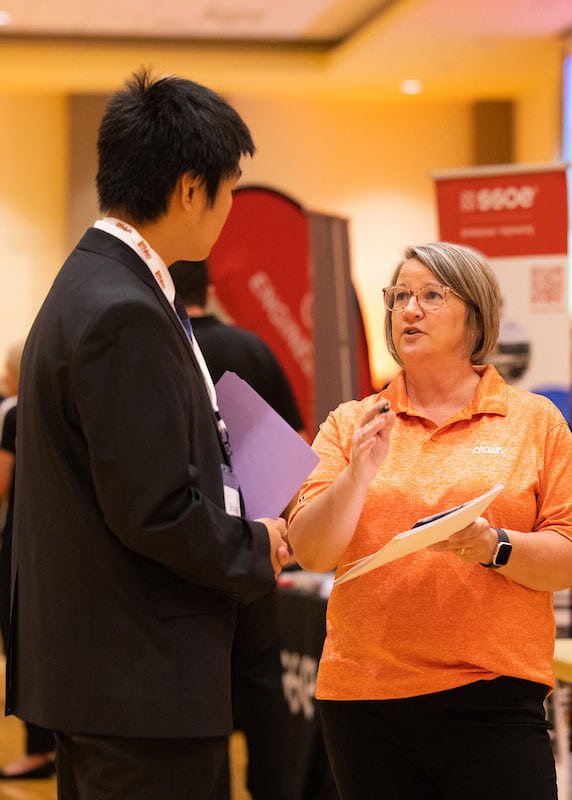 A student networks during a campus career fair