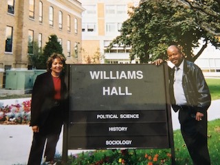 Monet and Clarence Daniels stand next to a Williams Hall sign at BGSU