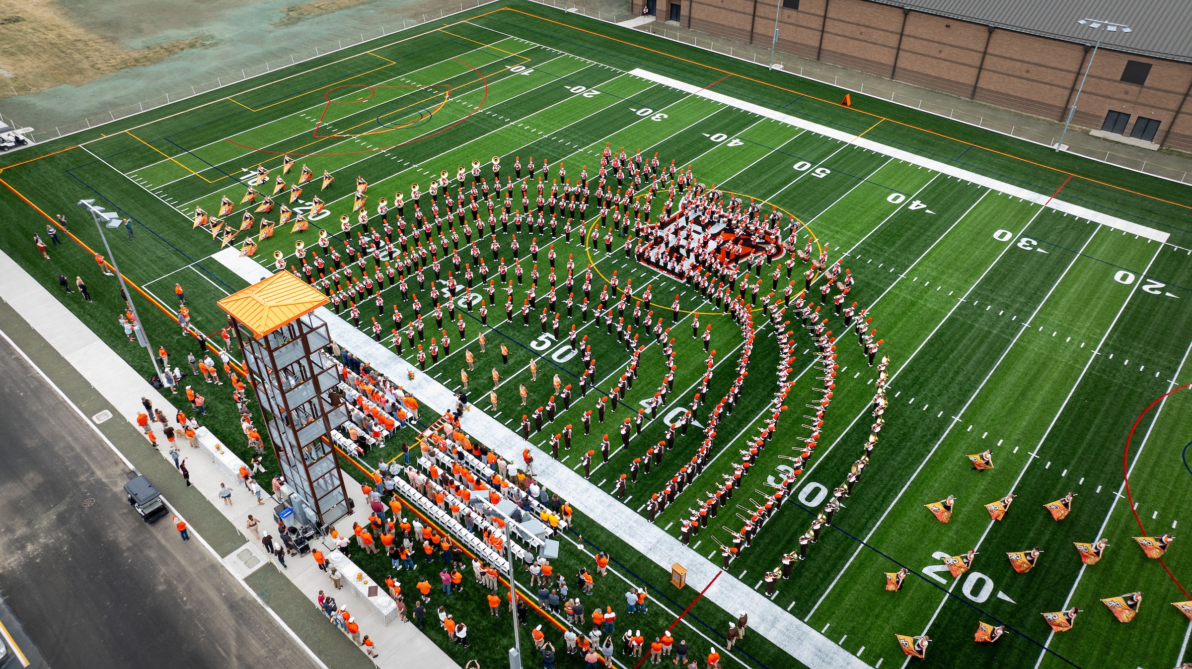 A drone image of The Student Green with the Falcon Marching Band performing