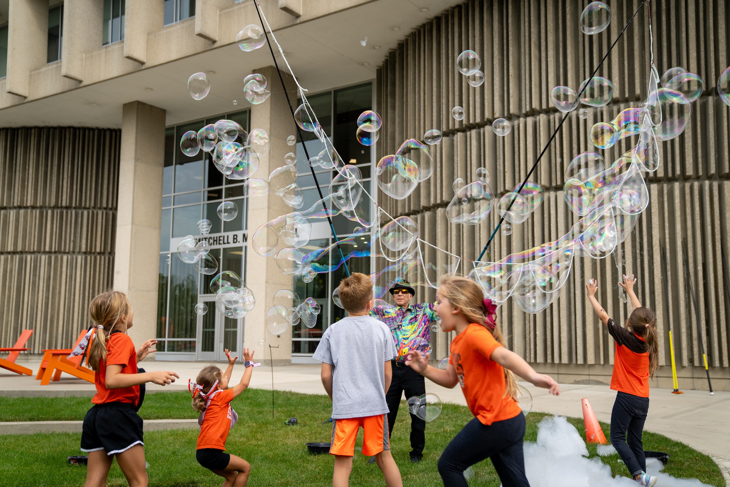 Kids enjoy bubbles at Kid Zone at BGSU Homecoming