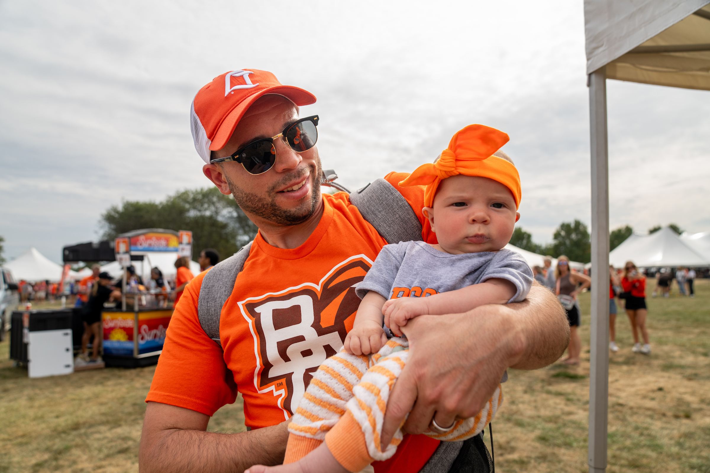 A person and baby at the Falcon Fan Fest