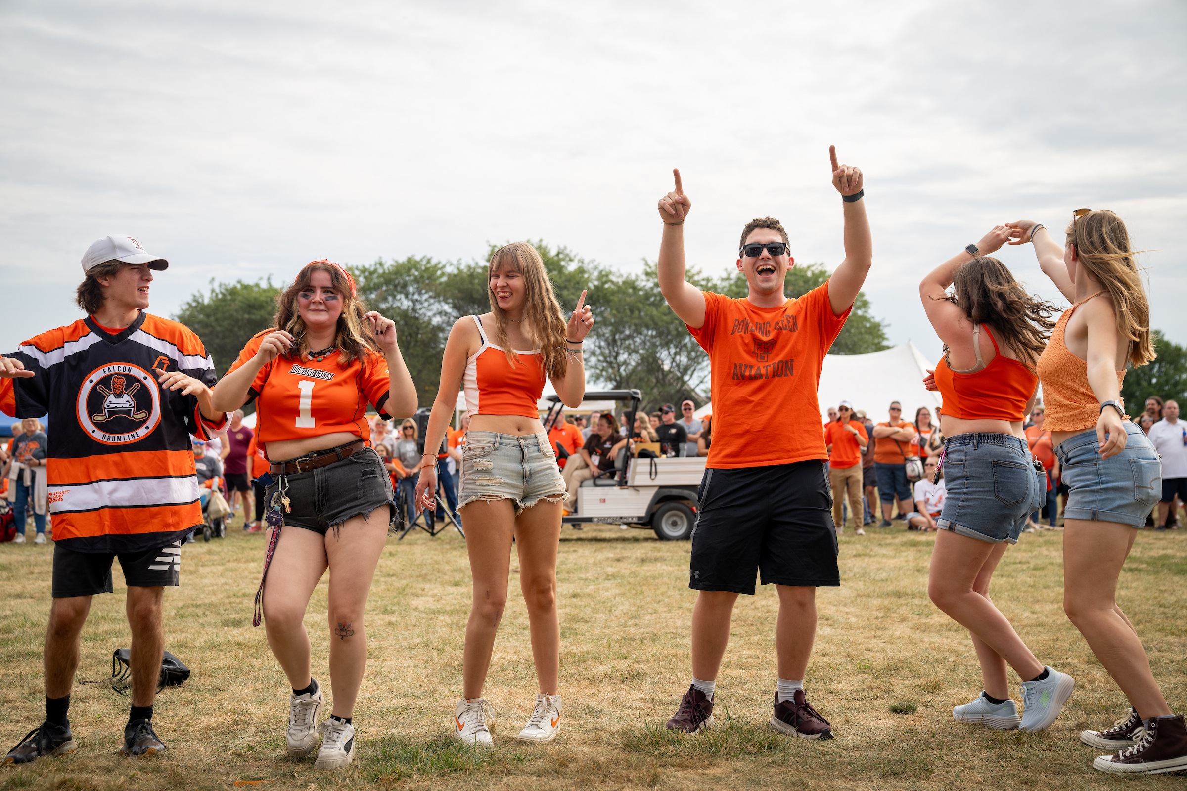 People dance and cheer