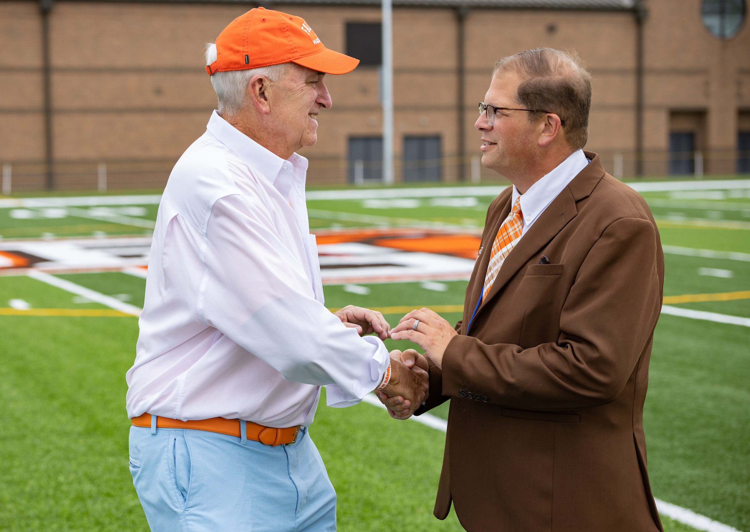 Alumnus Paul J. Hooker '75 with Falcon Marching Band Director Jon Waters