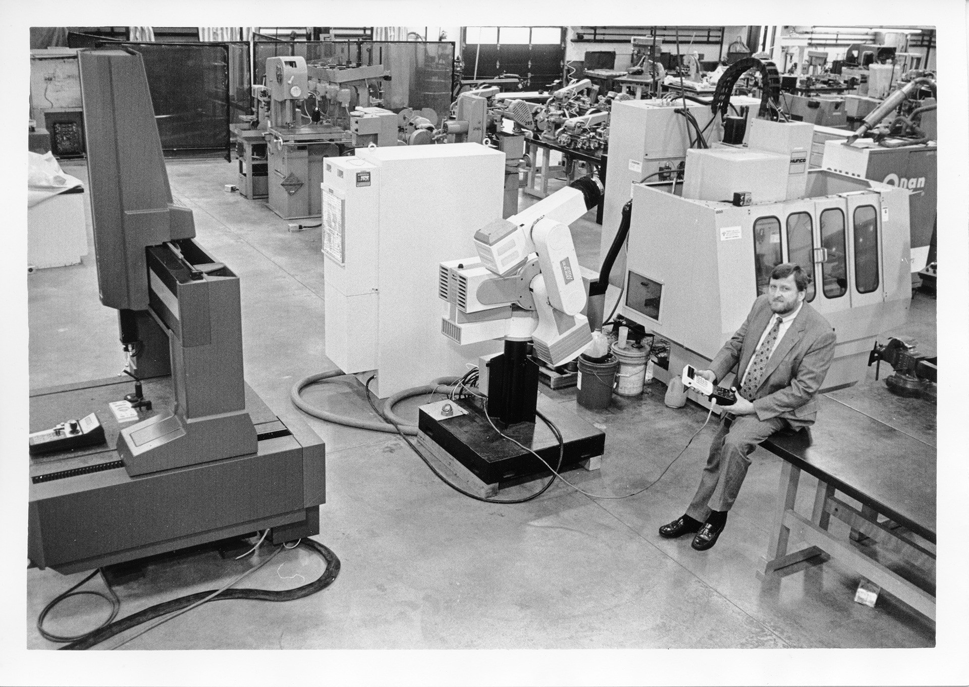 A person poses in front of new equipment.