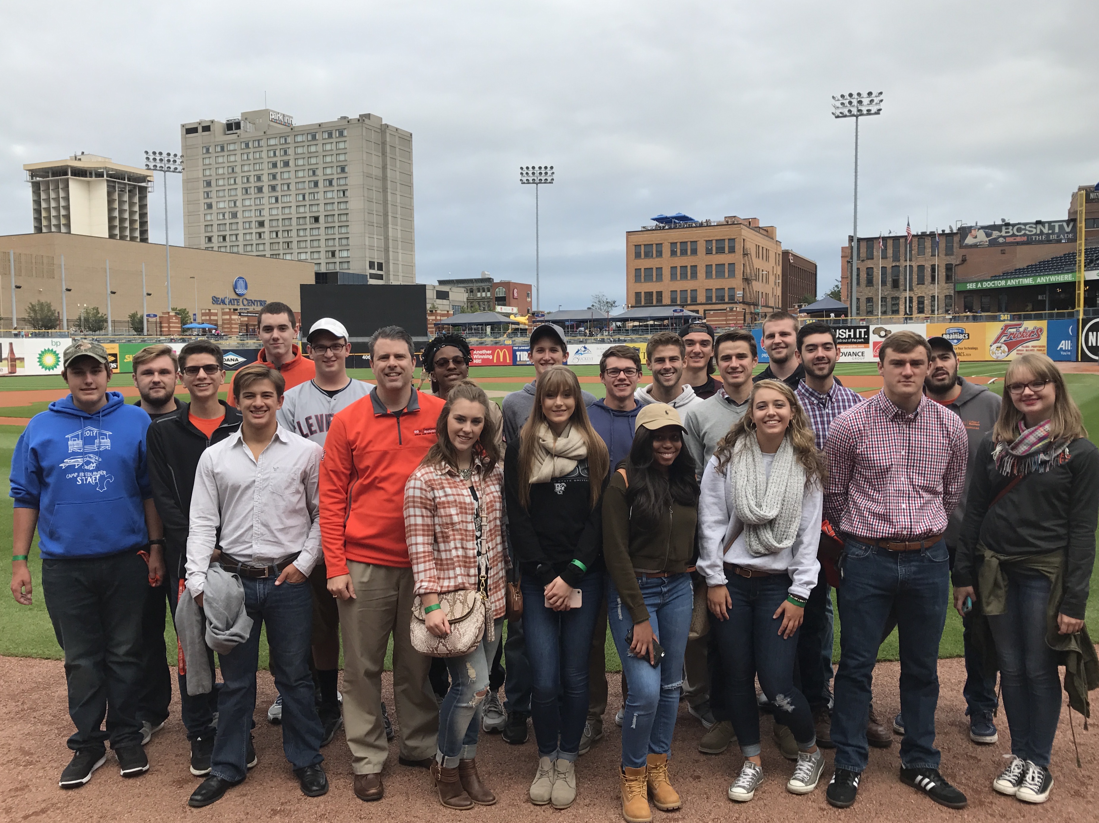 Students and faculty on baseball field