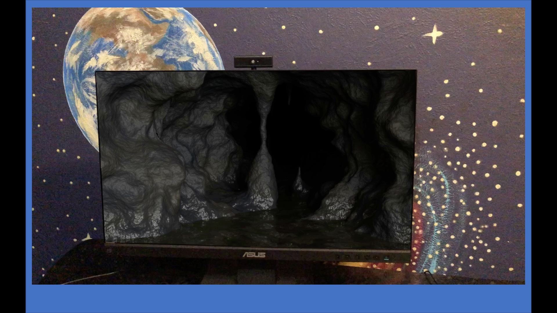 photo of computer screen and wall galaxy