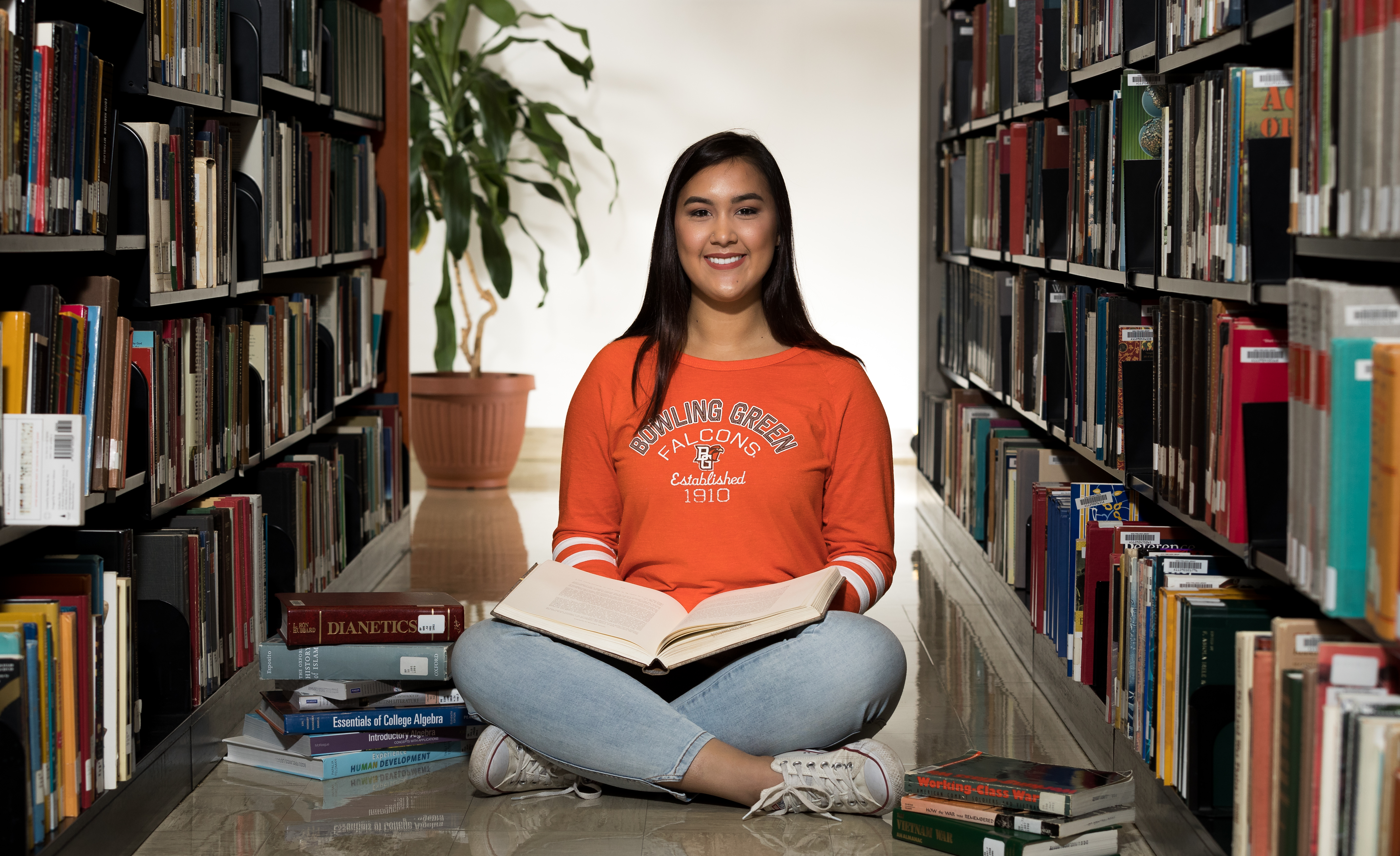 student sitting at library