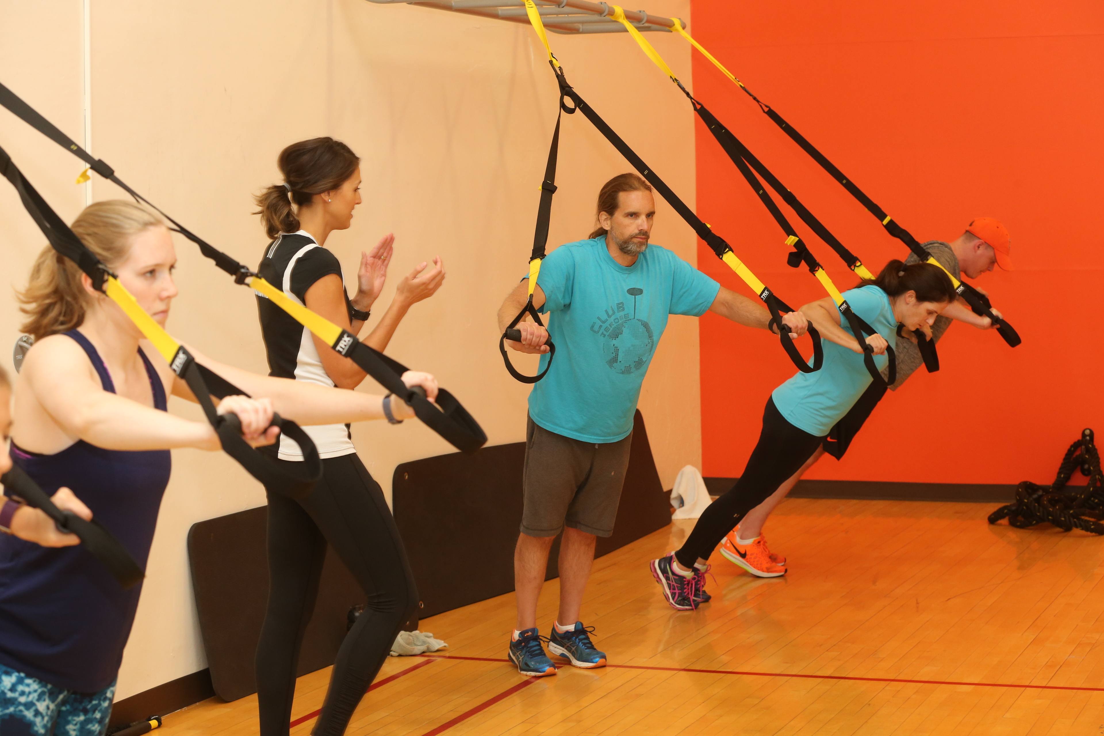 A group of adults participating in a fitness class